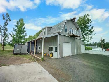 NEW PRICE! STUNNING 4.85 ACRE TRI-LEVEL HOME WITH BARNDOMINIUM