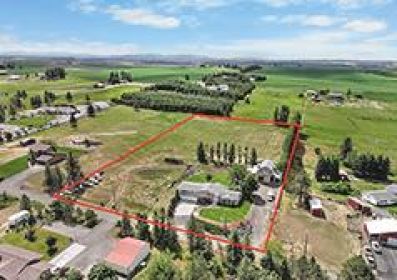 NEW PRICE! STUNNING 4.85 ACRE TRI-LEVEL HOME WITH BARNDOMINIUM