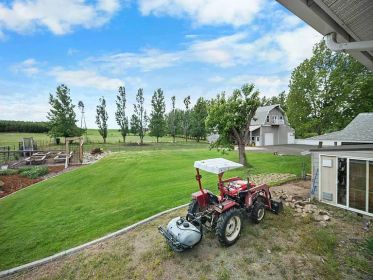 NEW PRICE! STUNNING 4.85 ACRE TRI-LEVEL HOME WITH BARNDOMINIUM