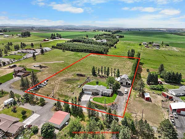 NEW PRICE! STUNNING 4.85 ACRE TRI-LEVEL HOME WITH BARNDOMINIUM