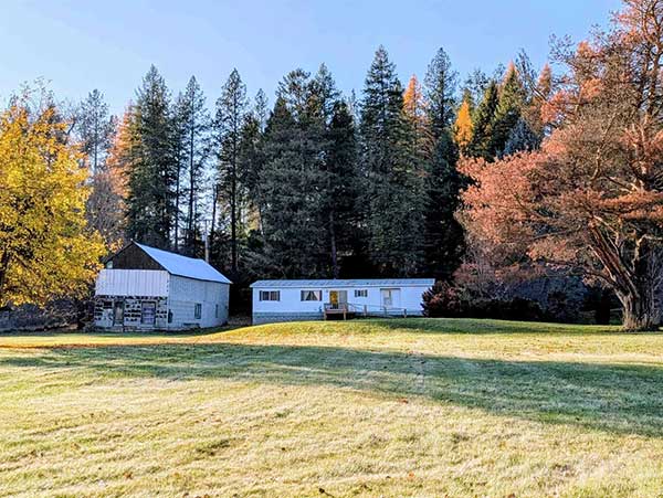 A RIVER RUNS THROUGH IT! HOME ON 4.35 ACRES WITH LITTLE