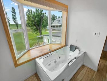 NEW PRICE! STUNNING 4.85 ACRE TRI-LEVEL HOME WITH BARNDOMINIUM