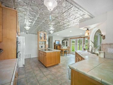 NEW PRICE! STUNNING 4.85 ACRE TRI-LEVEL HOME WITH BARNDOMINIUM
