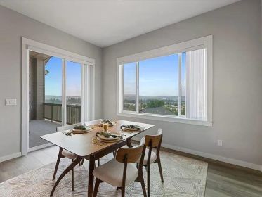 SWEEPING VIEWS, SOARING CEILINGS & MAIN FLOOR LIVING