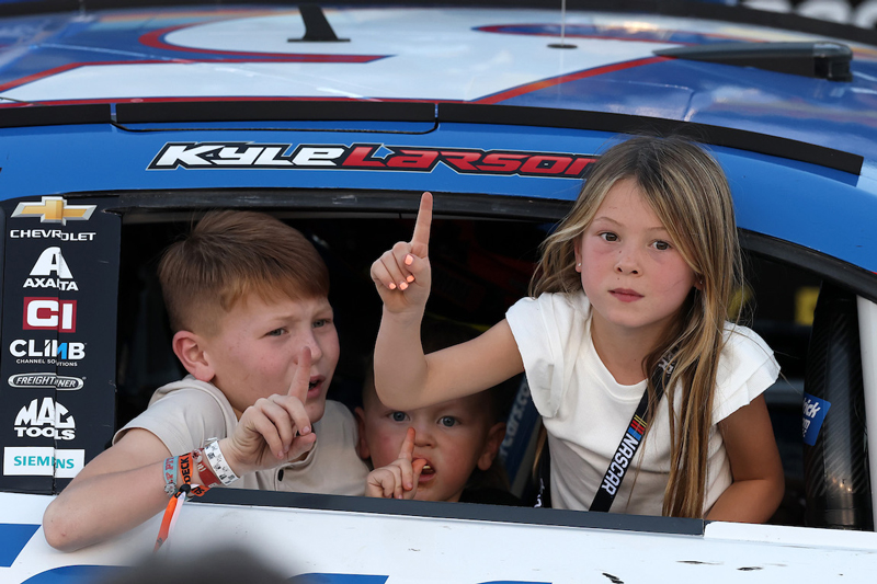 Kyle Larson, driver of the #5 HendrickCars.com Chevrolet, sons, Cooper Larson and Owen Larson and daughter Audrey Larson celebrate in victory lane in Avondale, Arizona. NASCAR photo