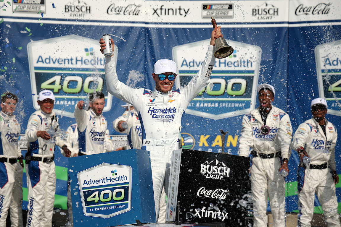 Kyle Larson, driver of the #5 HendrickCars.com Chevrolet, celebrates in victory lane after winning the NASCAR Cup Series AdventHealth 400 at Kansas Speedway on May 11, 2025 in Kansas City, Kansas. NASCAR Photos