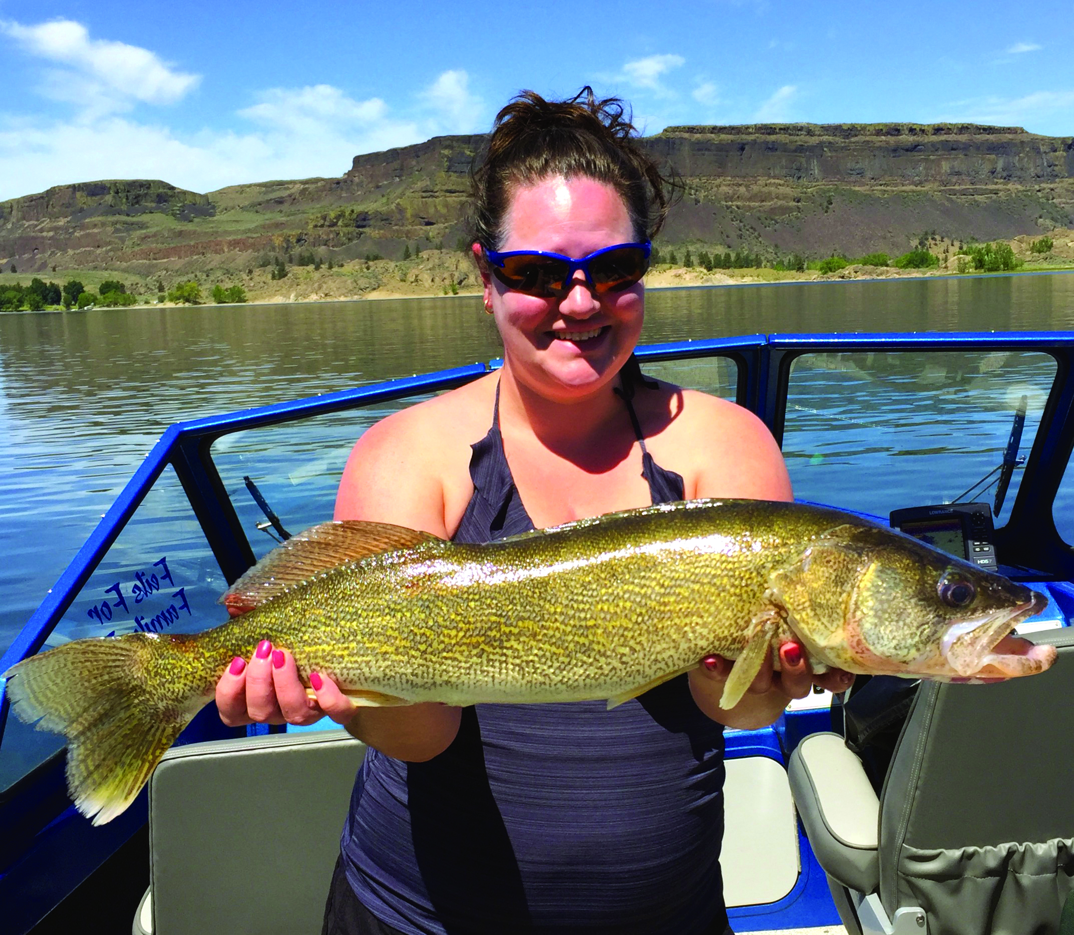 Dave holding a 21-inch walleye caught on Moses Lake during a productive early morning trip.